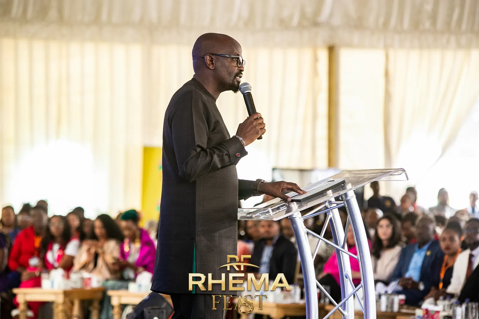 Rev. Julian Kyula on stage at the Business Forum 2025