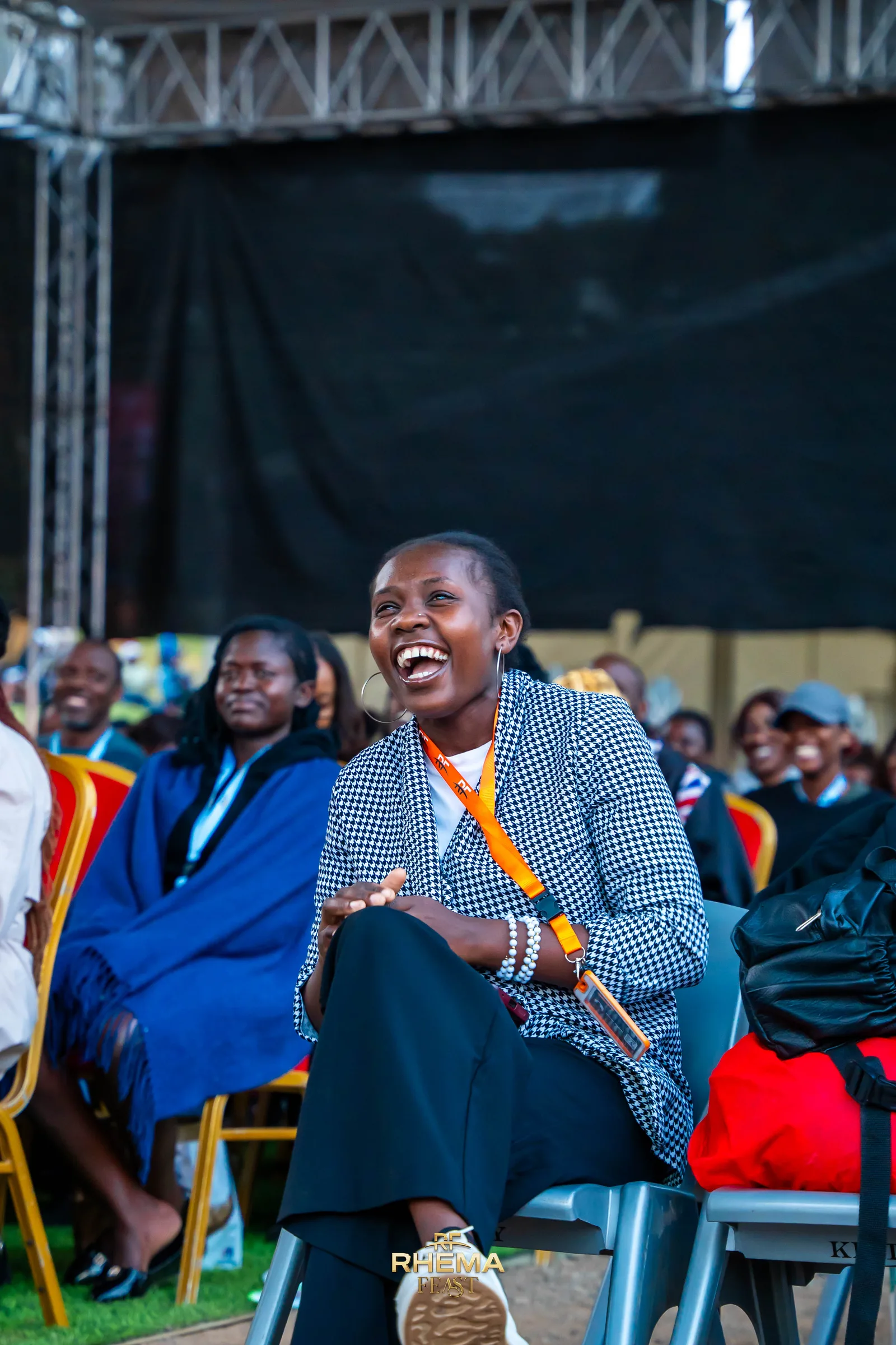 A delegate laughing during the teaching, the rows behind her listening