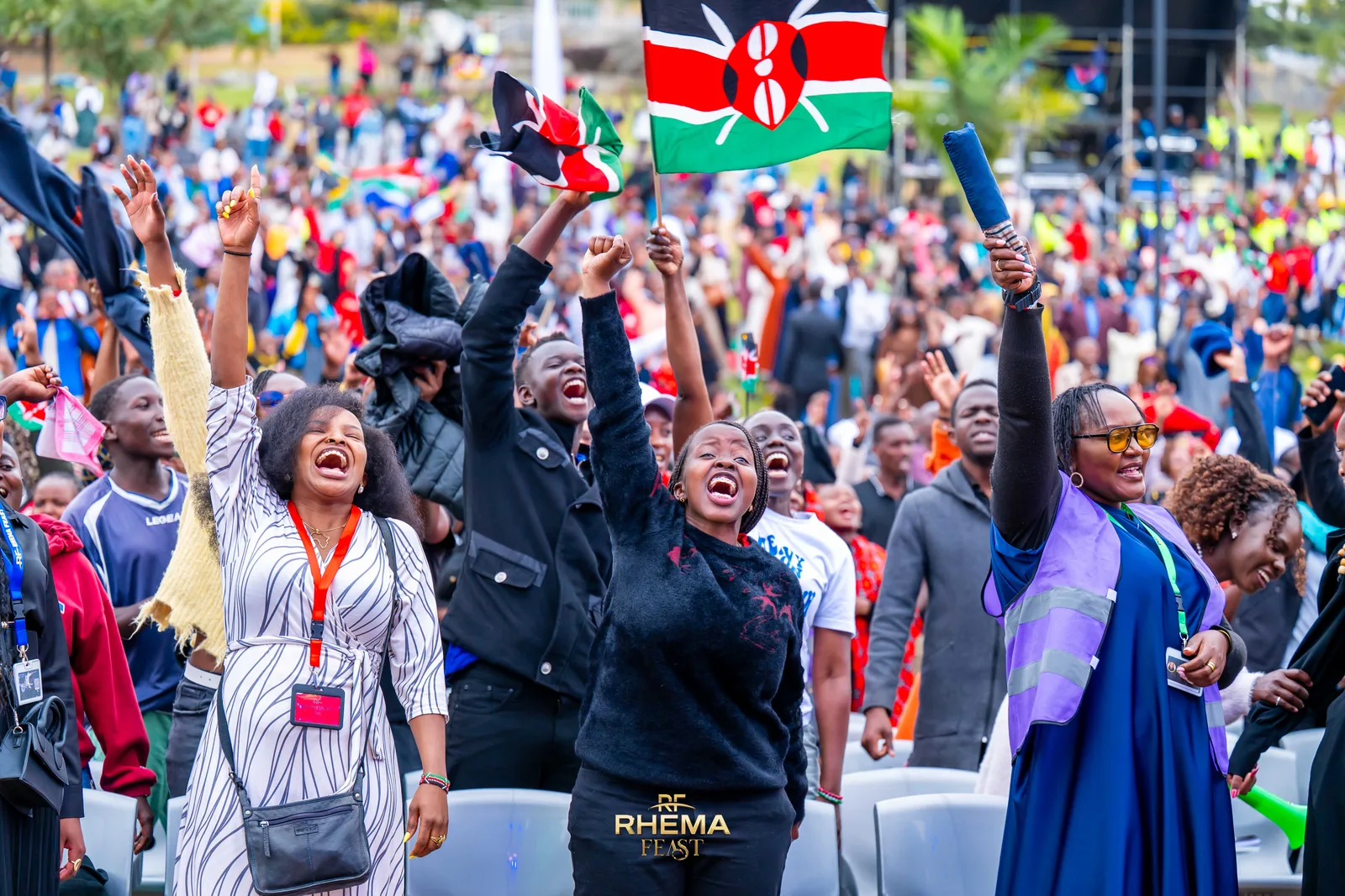 Kenyan flags raised above the crowd at Uhuru Park