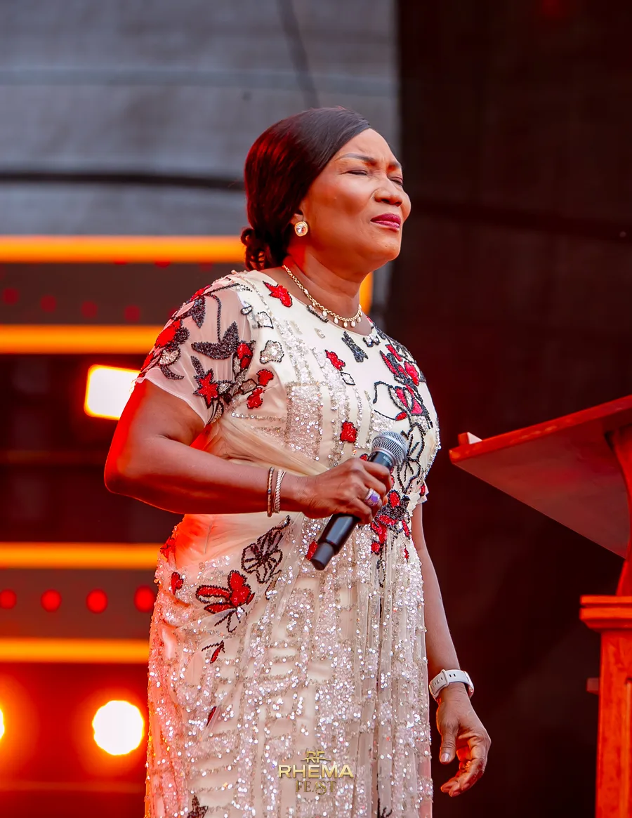 Bishop Funke Felix-Adejumo mid-sentence, eyes closed
