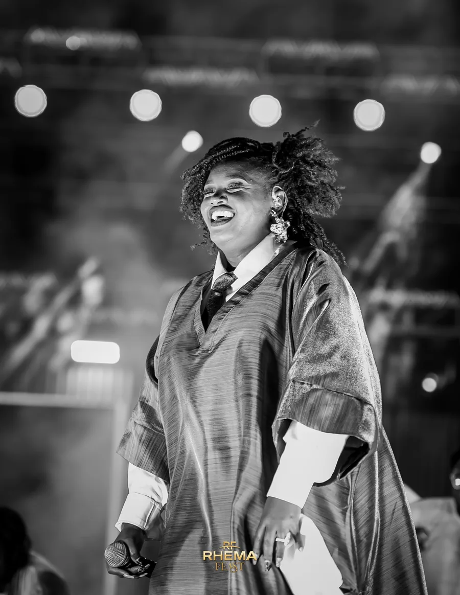 Njoki Munyi leading worship, head back, mid-note