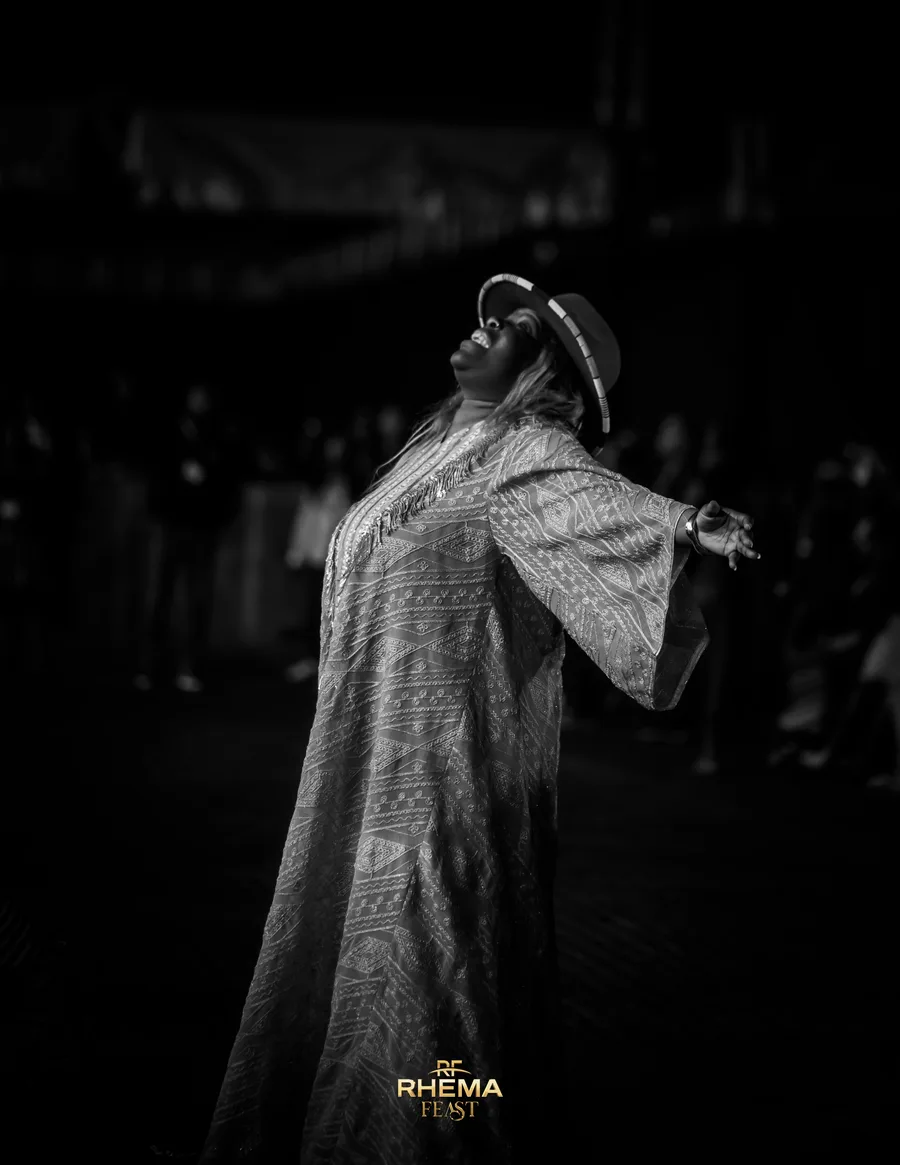 Ntokozo Mbambo with both arms open on the night stage