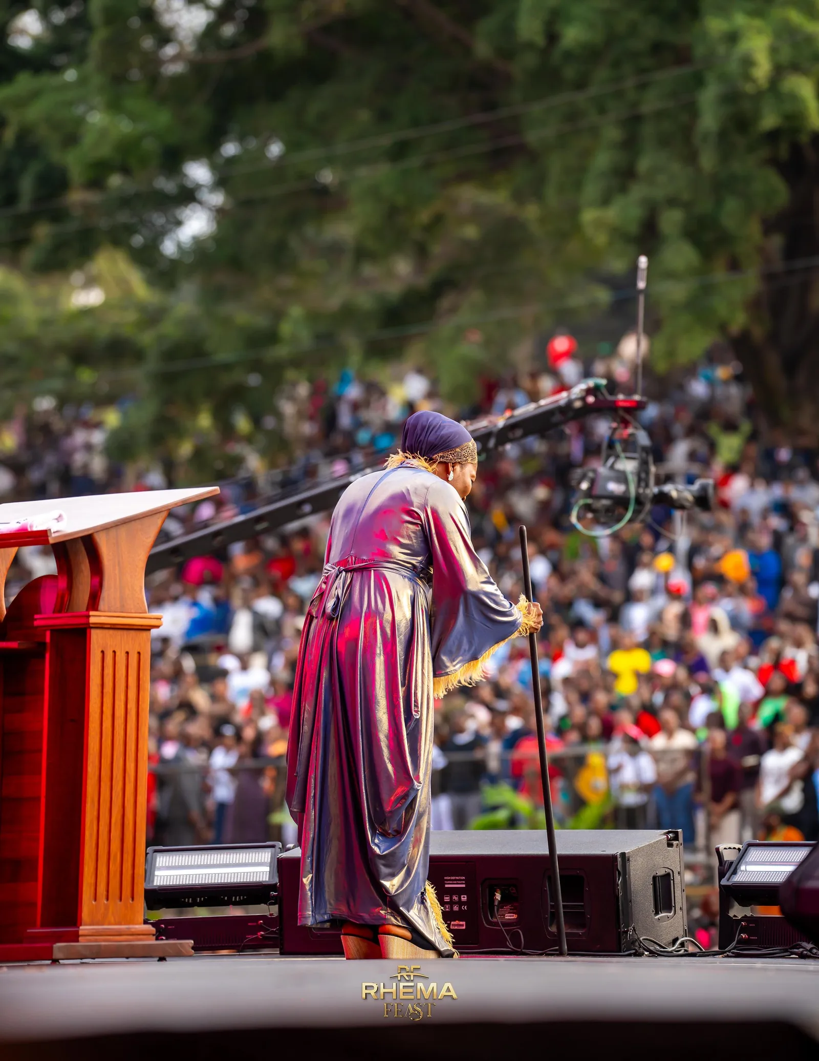 Bishop Funke Felix-Adejumo at the podium, the field stretching behind her