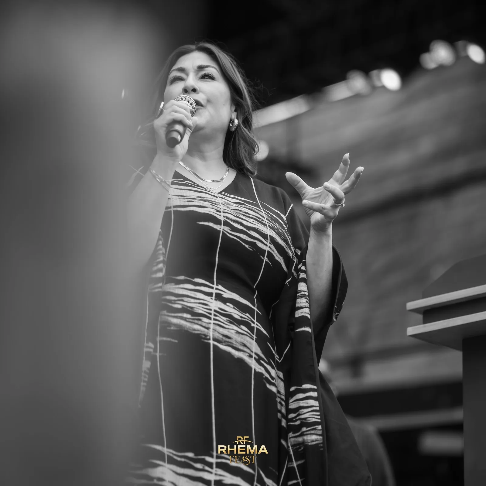 Rev Laura in prayer, in black and white
