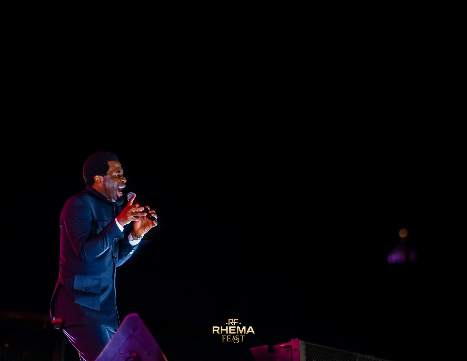 Apostle Michael Orokpo, in black and white, mid-sentence
