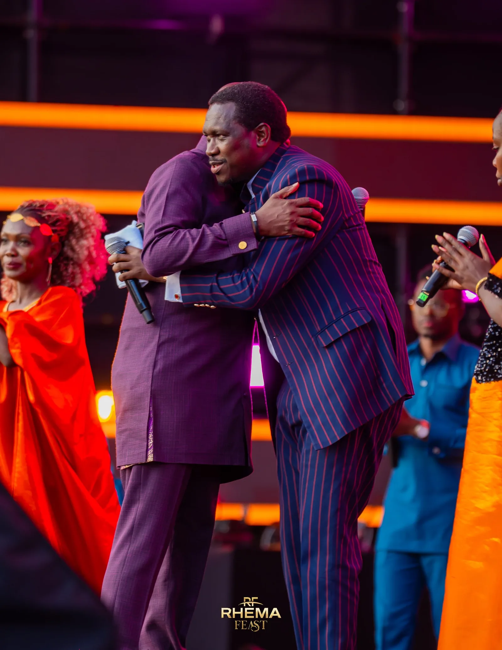 An embrace on the platform during the generational blessing