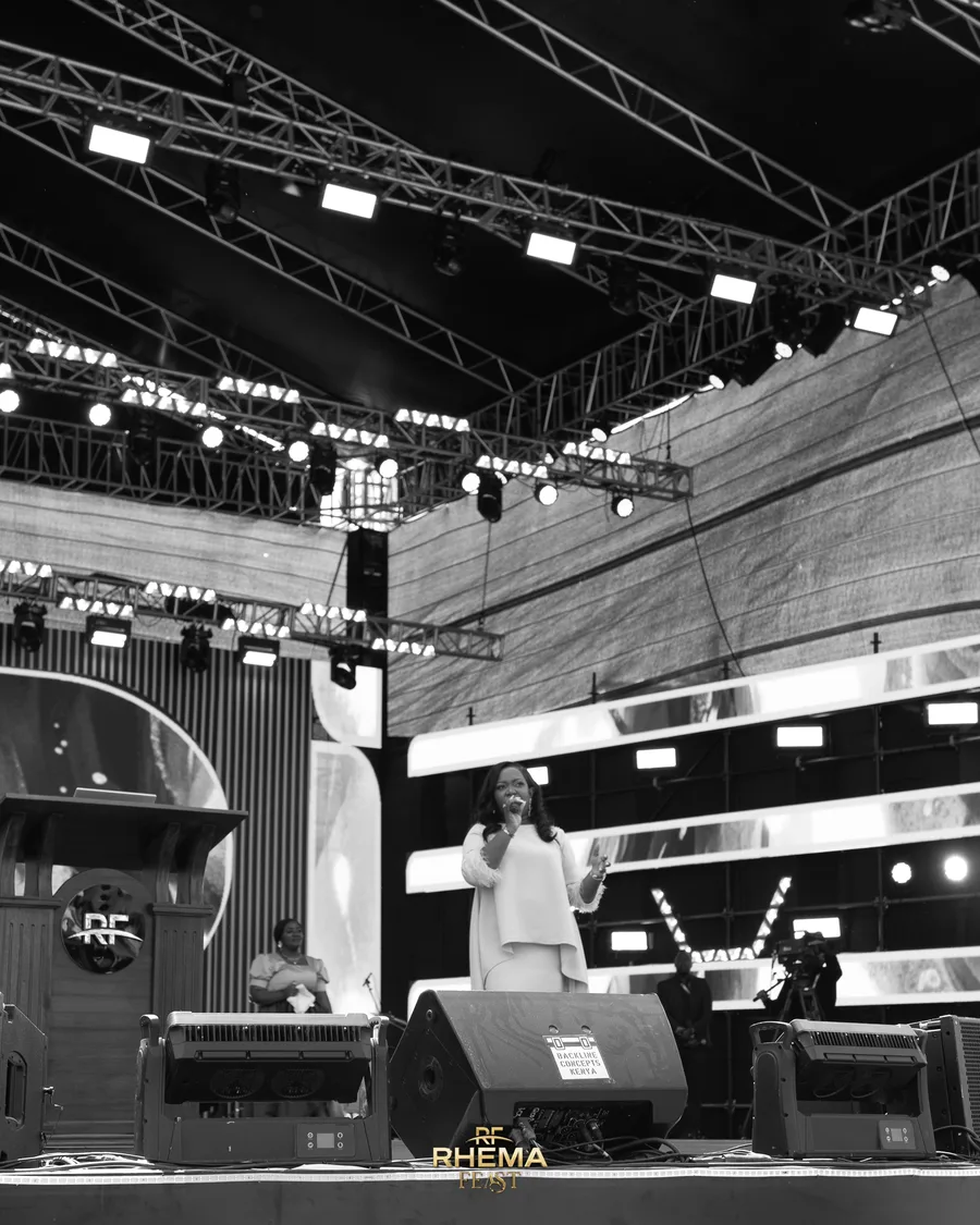 Rev. Lee Wambugu preaching, in black and white