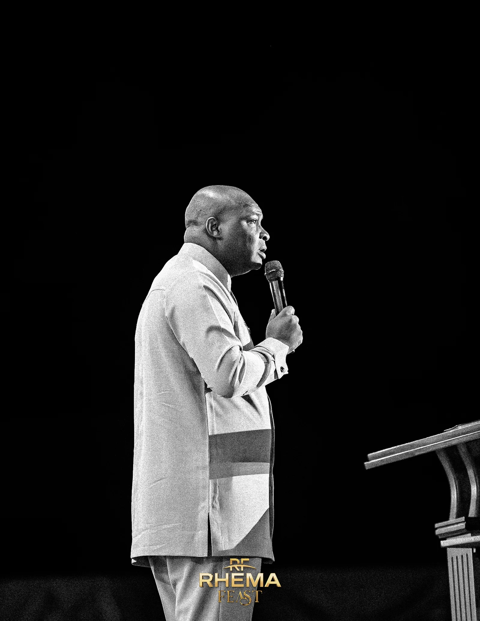 Apostle Joshua Selman mid-charge, in black and white