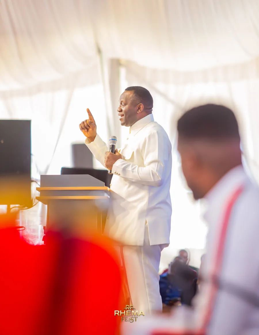 Dr. David Ogbueli preaching in the daylight of the tent